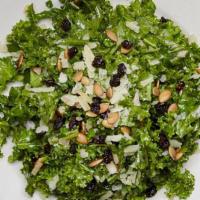 Kale Manchego Salad · Kale, manchego cheese, dried currants and roasted pumpkin seeds tossed in a sweet and spicy ...