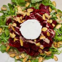 Beet And Goat Cheese Salad · Roasted beet salad with goat cheese, crushed pistachios, orange zest and pickled red onions ...