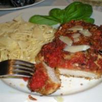Veal Parmigiana · Tender medallions of veal served with our homemade tomato sauce and topped with mozzarella c...