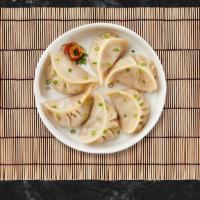 Five Star Thai Dumpling · Steamed mixed chicken and shrimp dumpling. Served with soy-vinaigrette dipping sauce.