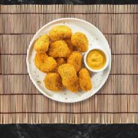 Chicken Nugget · Bite sized nuggets of chicken breaded and fried until golden brown. Served with your choice ...