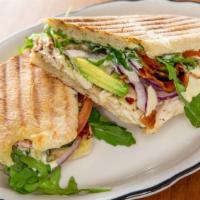 Chicken Panini · Swiss cheese, bacon, avocados, red onions, arugula, tomatoes, with French mustard vinaigrette.