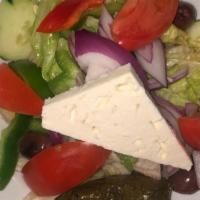 Greek Salad · Romaine lettuce, cucumbers, onions, peppers, tomatoes, feta, grape leaves, anchovies and oli...