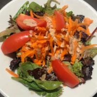 House Salad · Mixed greens, tomatoes and carrots with a creamy balsamic vinaigrette.