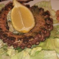 Octopus · Char‐grilled, served over romaine and chilled butter beans.