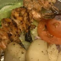 Shrimp Souvlaki Platter · Grilled jumbo shrimp topped with E.V.O.O. and lemon, served with choice of side with lettuce...