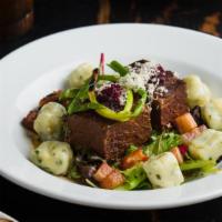 Red Wine Braised Short Ribs · chive gnocchi, house cured bacon lardon, and red onion compote.