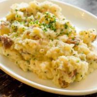Crushed Potatoes · with roasted garlic.