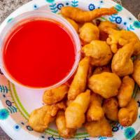 Sweet & Sour Chicken Dinner · Served with pork fried rice and egg roll.