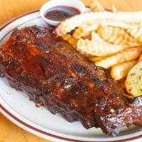 Baby Back Ribs · Comes with one side, and one small side bbq (2oz).