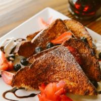 French Toast · Served with bananas strawberry's and blueberries.