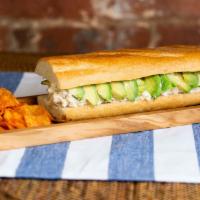 The Queen · Creamy chicken salad (pulled breast with mayo-based dressing) and avocados on a warm baguette.