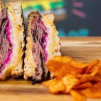The Shop'S Reuben · Beef pastrami, red cabbage slaw pickled red onions, sriracha mayo, and swiss cheese pressed ...