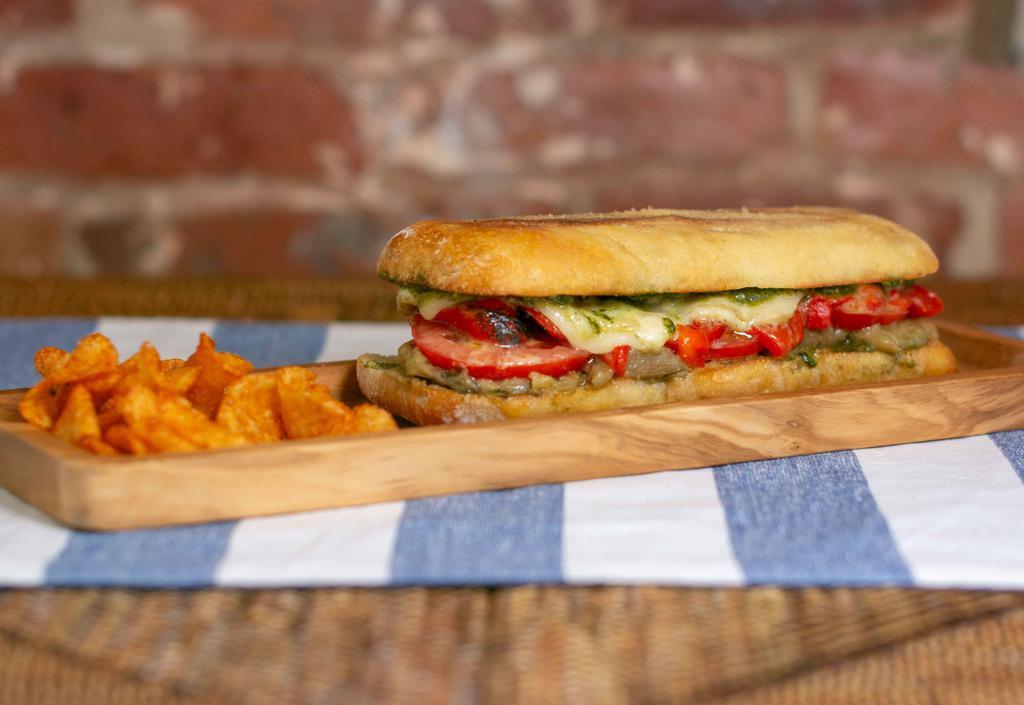 The Veggie · Vegetarian. Roasted red peppers and mushrooms, tomatoes, roasted onions, basil, pesto and mozzarella cheese pressed on ciabatta.