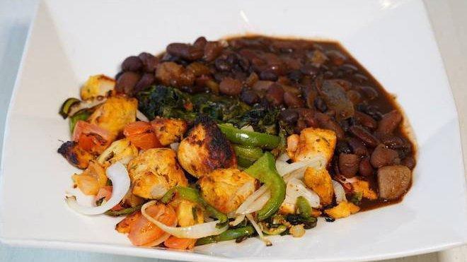 Energy Lean · Chicken, peppers, onions, and tomatoes over sauteed spinach topped with vegetable chili.