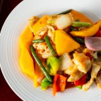 Thai Mango Chicken · Fresh mango, snap peas, and green and red peppers.