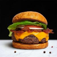 Bacon Buster Burger · American beef patty topped with melted cheese, layers of crispy bacon, lettuce, tomato, onio...