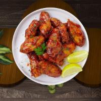 Sweet Bbq Wings · Fresh chicken wings breaded, fried until golden brown, and tossed in honey and barbecue sauc...