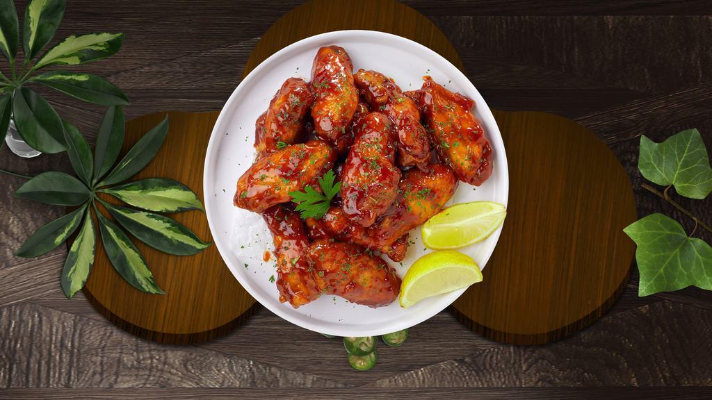 Sweet Bbq Wings · Fresh chicken wings breaded, fried until golden brown, and tossed in honey and barbecue sauce. Served with a side of ranch or bleu cheese.
