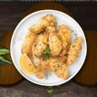 Pretty In Parm Wings · Fresh chicken wings breaded, fried until golden brown, and tossed in garlic and parmesan. Se...