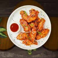 Oriental Over Wings · Fresh chicken wings breaded, fried until golden brown, and tossed in sweet and sour sauce. S...