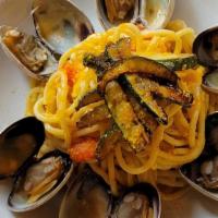 Spaghetti Alla Sarda · spaghetti with squid ink, clams, zucchini and bottarga