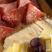 Tagliere · assortment of cured meats and cheeses served with Sardinian flat bread