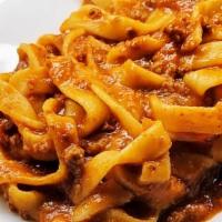 Fettuccine · with beef and veal ragú and pecorino Romano
