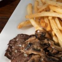 Skirt Steak · Grilled skirt steak with mushroom sauce served with french fries & sauteed spinach.