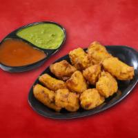 Country Cheese Fritter · Fresh cottage cheese cubes coated in seasoned gram flour batter and deep-fried.