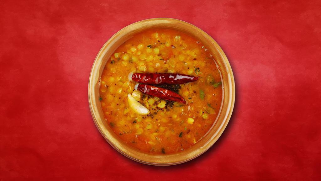 Yellow Youth Lentil · Fried yellow dal garnished with garlic, dry red chili, and cumin seeds.