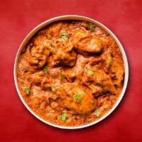 Chicken Conspiracy · Roasted marinated chicken chunks in spiced orange-colored curry tomato sauce.