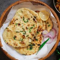 Garlic Naan · Fresh, puffy flatbread loaded with fresh garlic and ghee freshly baked to order.