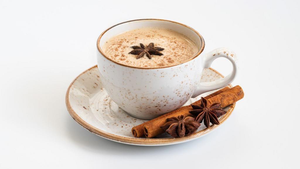 Masala Chai (Spiced Milk Tea) · Aromatic Indian tea leaves steep in milk with warming spices including green cardamom, cinnamon, clove, anise, fennel, nutmeg, ginger, fennel and black pepper.