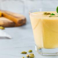 Mango Lassi · Sweet, thick and creamy chilled yogurt drink blended with sweet, ripe mangoes.