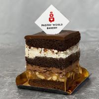 Snickers Cake Slices · Caramel with peanuts, chocolate sponge cake, milk chocolate ganache and mascarpone cream. In...