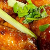Jala-Mango Wings · Oven baked chicken wings coated on Jalapeno and Mango sauces