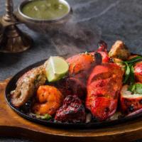 Tandoori Mixed Grill · Shrimp / chicken-tandoori / tikka / malai kebab / seekh kebab.