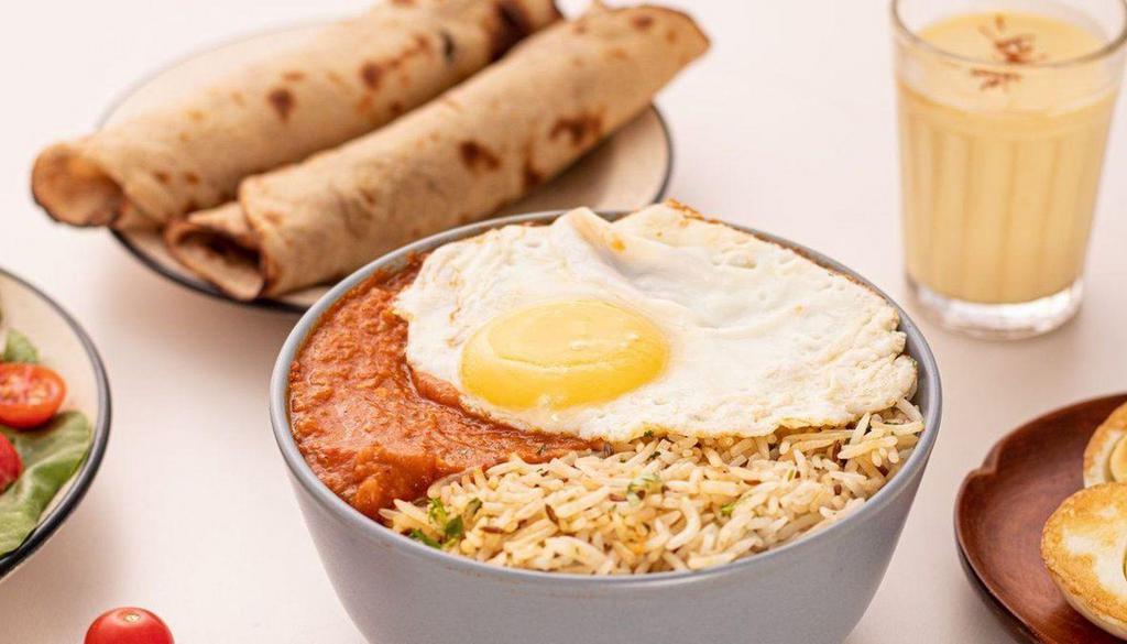 Egg Bhaji Bowl · Sliced hardboiled eggs in a spiced veggie curry popular in Mumbai, served with cumin rice. Spice Level: Medium