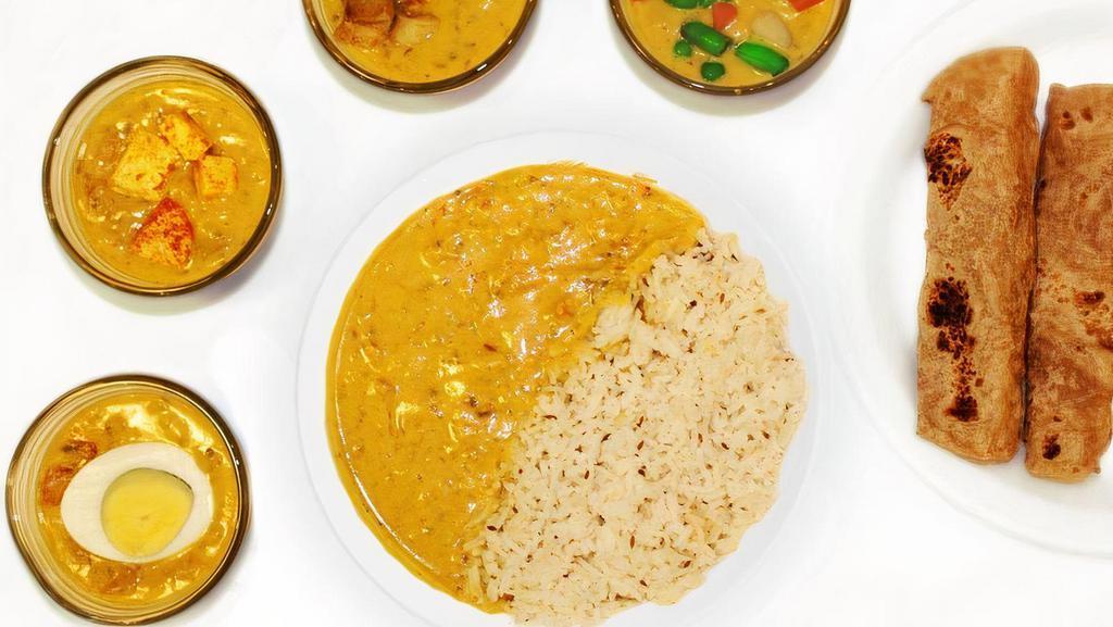 Punjabi Kadhi · Protein of your choice marinated in a tangy sauce with yogurt and chickpea-flour. Spice Level: Mild