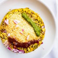 Bhel Puri · Puffed rice, savory morsels, chutneys, and peanut.