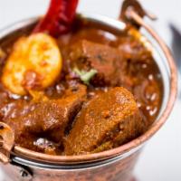 Chicken Vindaloo · Chicken in a tangy fiery sauce.