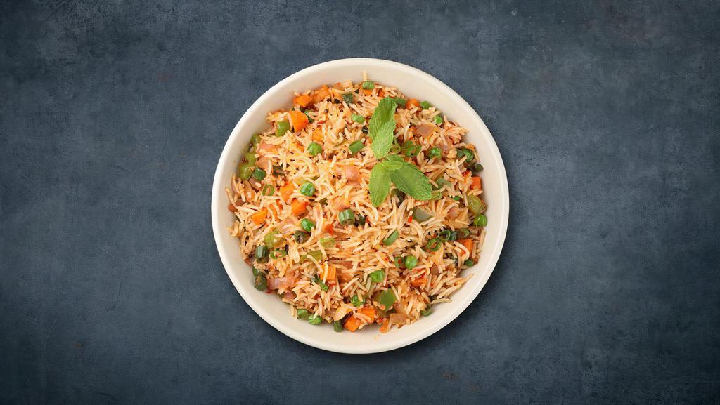 'Licious Veggie Biryani · Long grain basmati rice cooked with garden fresh vegetables in a blend of Indian exotic spices and herbs.