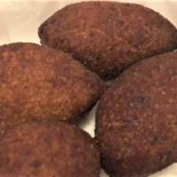Kibbe · Meat and bulgur shells stuffed with ground beef, onions, & nuts.
