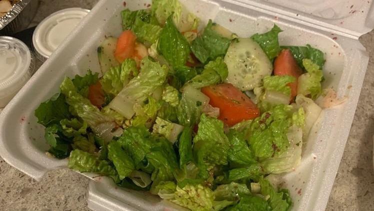 House Salad · Lettuce, tomatoes, cucumber, parsley, and red onion in house dressing.