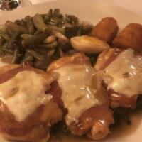 Chicken Saltinbocca · Chicken topped with proscuitto, mozzarella cheese, served over spinach
