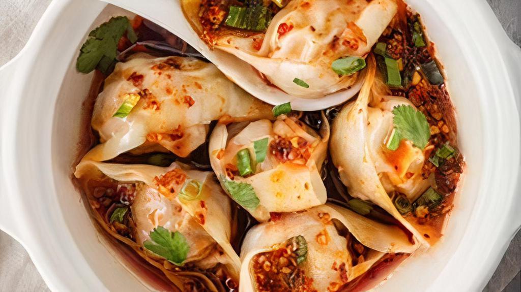 Pork Dumplings · 10 pieces dumplings in chili oil with scallions.