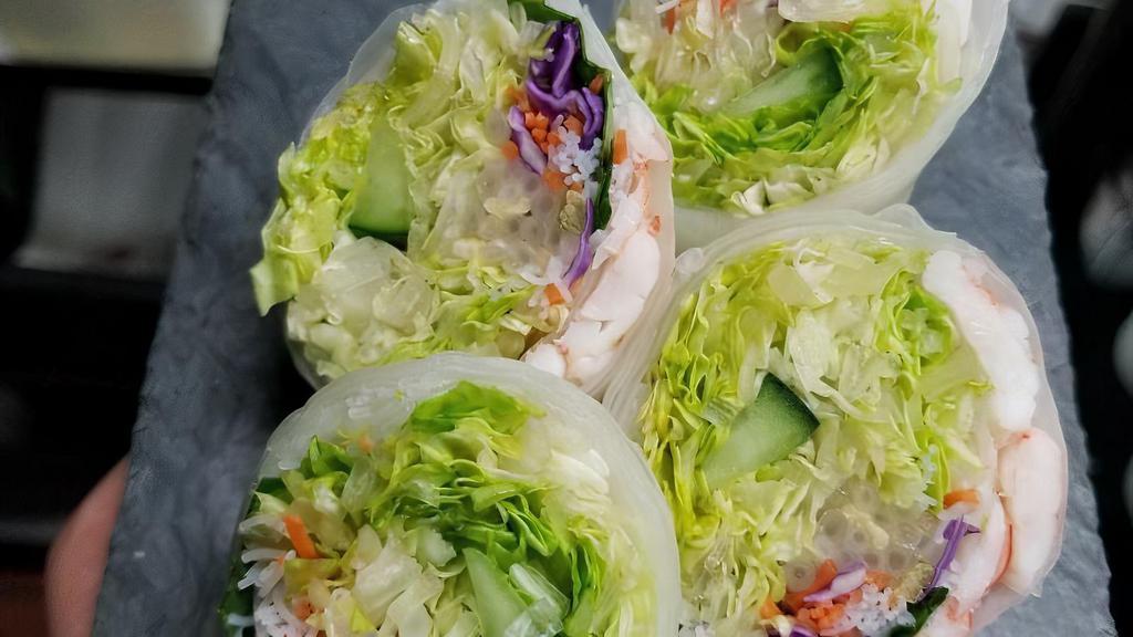 Summer Rolls (4 Pieces) · Lettuce, basil, carrots, purple cabbage, bean sprouts, and rice noodles wrapped in soft rice paper. Served with our special tangy peanut sauce.
