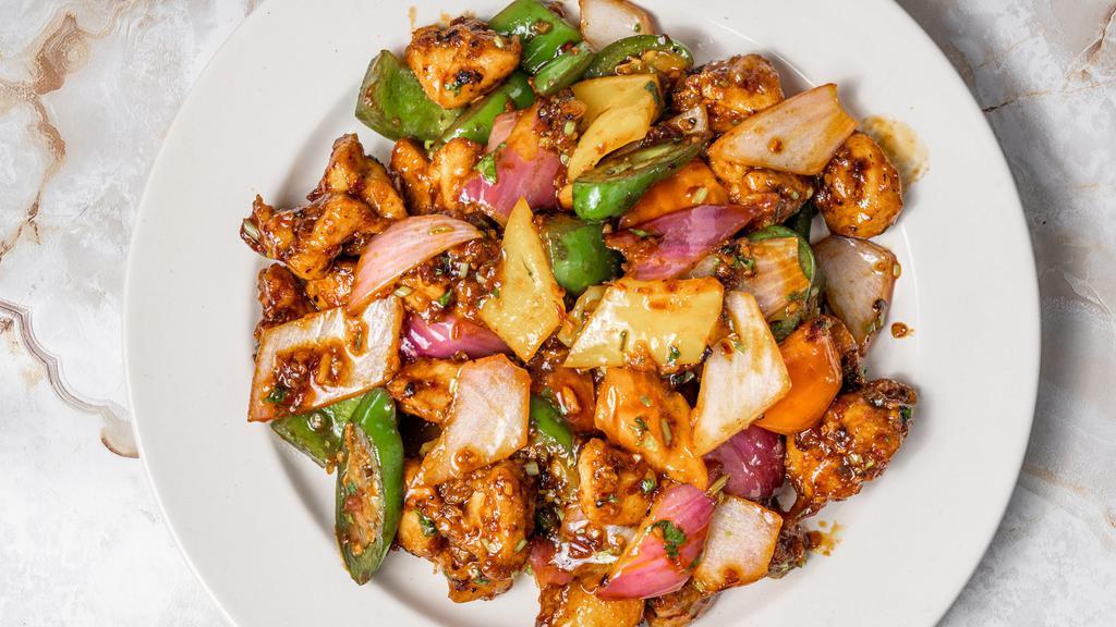 Chilly Chicken With Sauce · Chicken & onion pepper tossed in Bombay style Chinese chilli sauce.