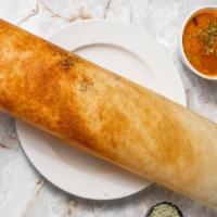 Masala Dosa · From the Coromandel Coast. A paper-thin rice & lentil crêpe stuffed with spiced potatoes & p...